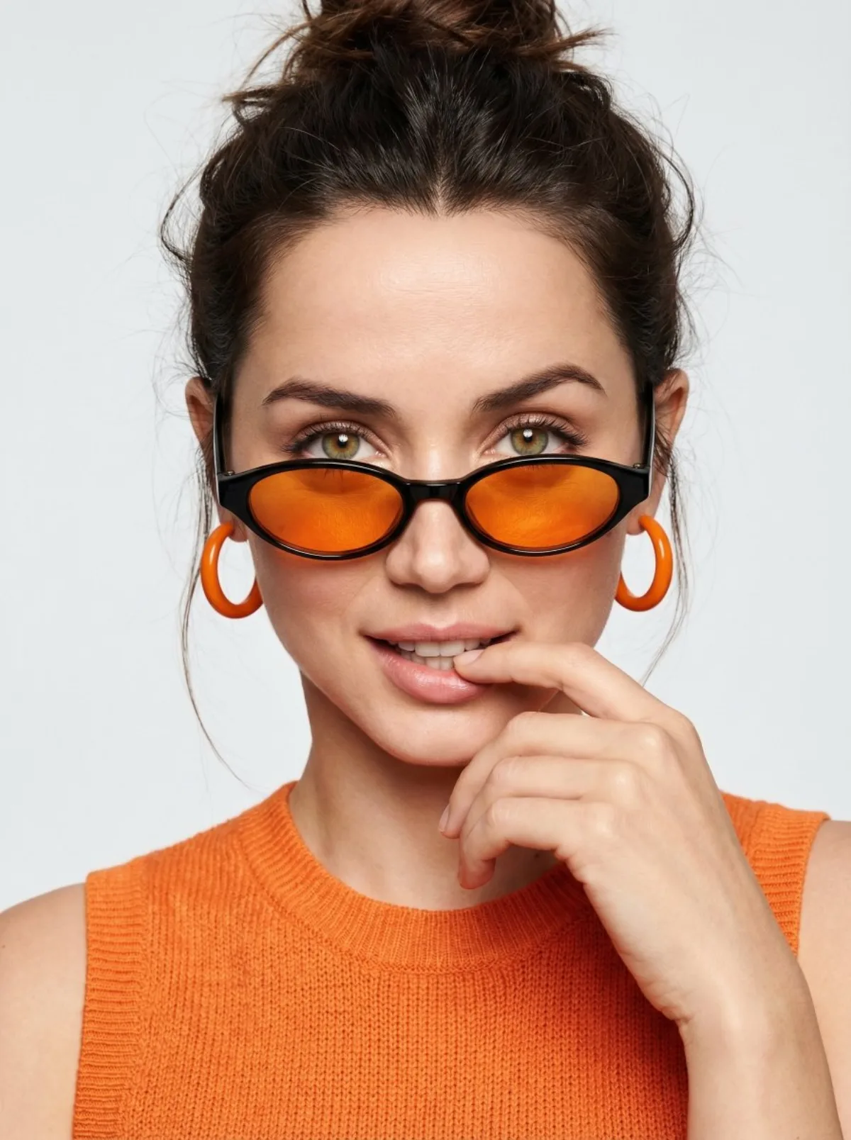 A Hero Playful Orange Fashion Portrait with Sunglasses