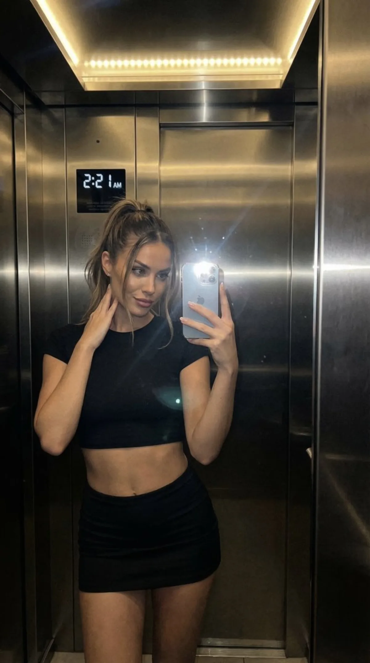 Refined Nightlife Portrait in Luxury Hotel Elevator
