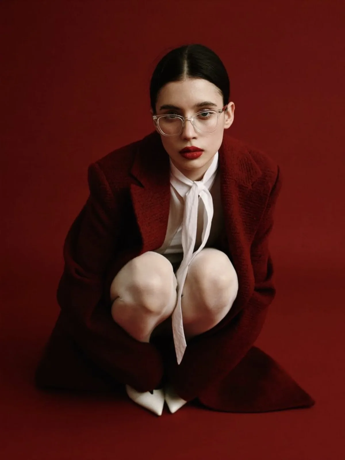 High-Fashion Portrait with Red Coat and Bow Tie