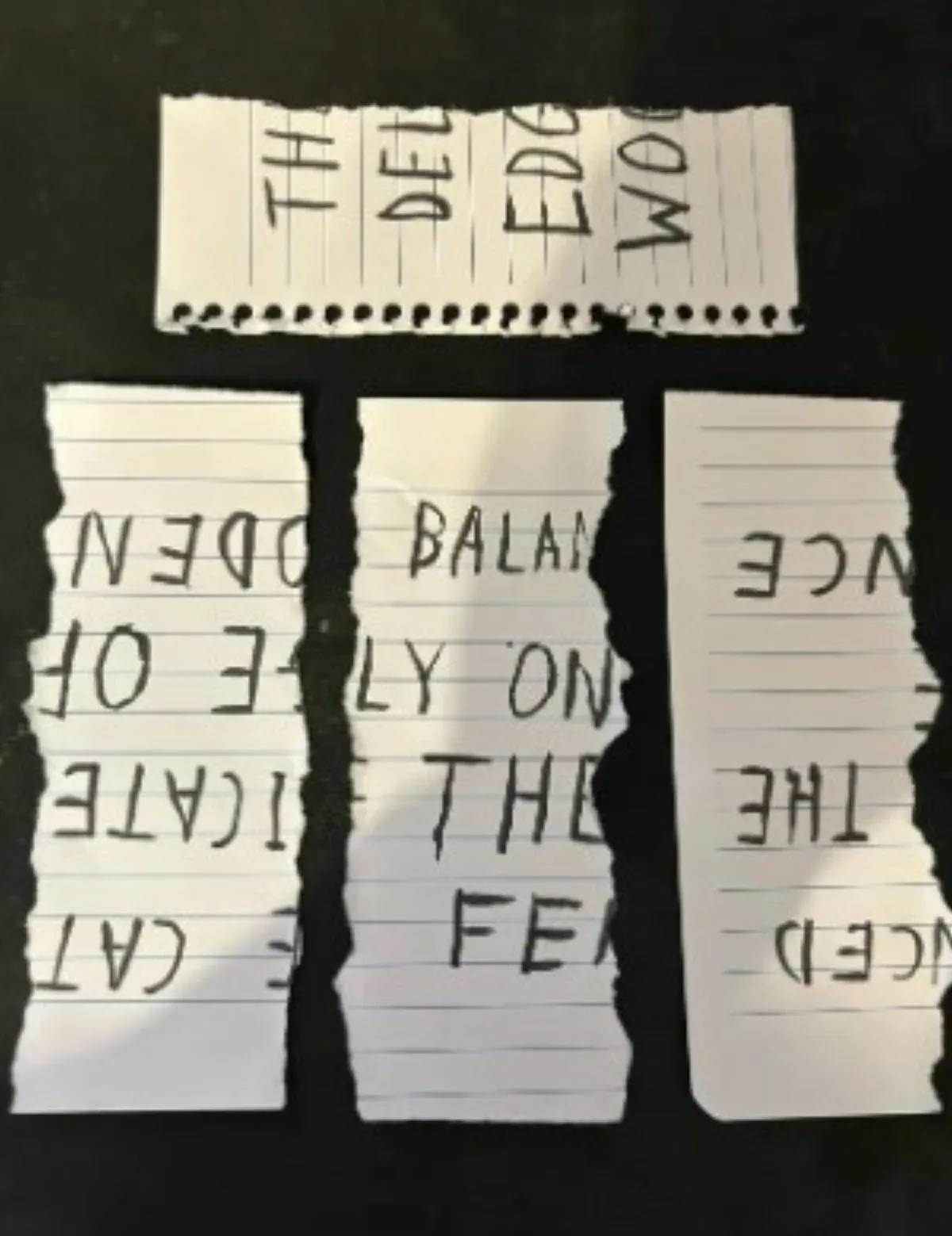 A Stylized Assemble message from torn and mixed-up pieces