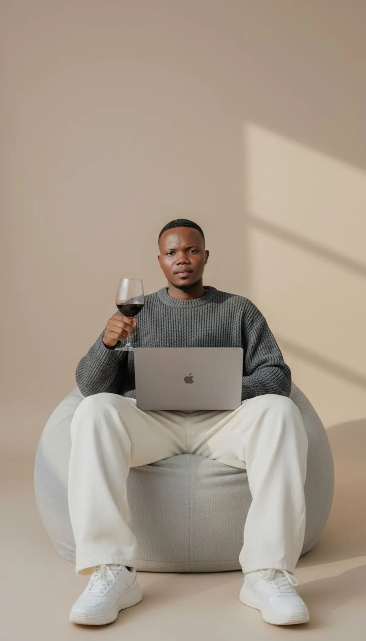 Male Model on Beanbag with MacBook and Wine