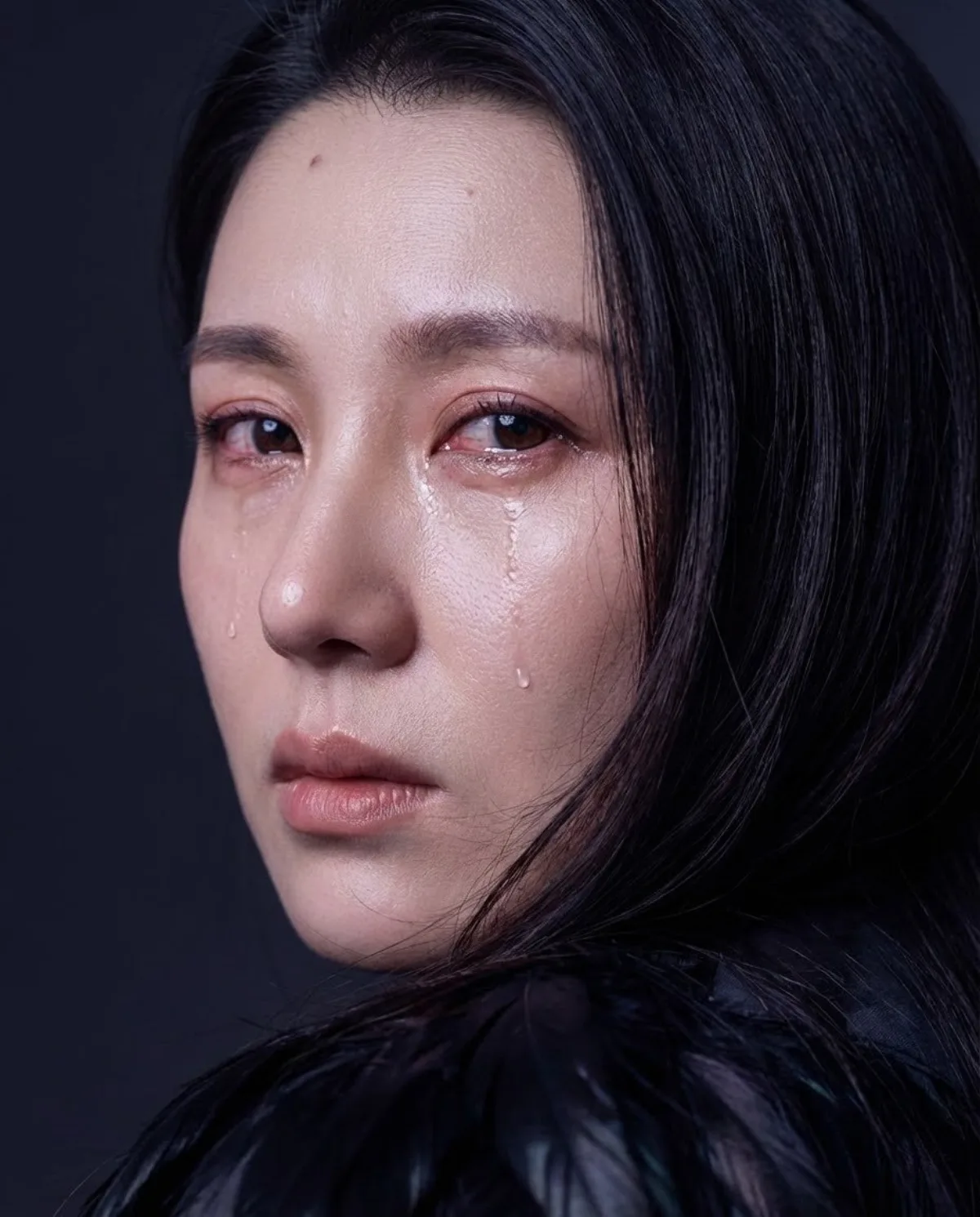 Close-up Portrait of a Girl with Tear Streaks: A Editorial Take